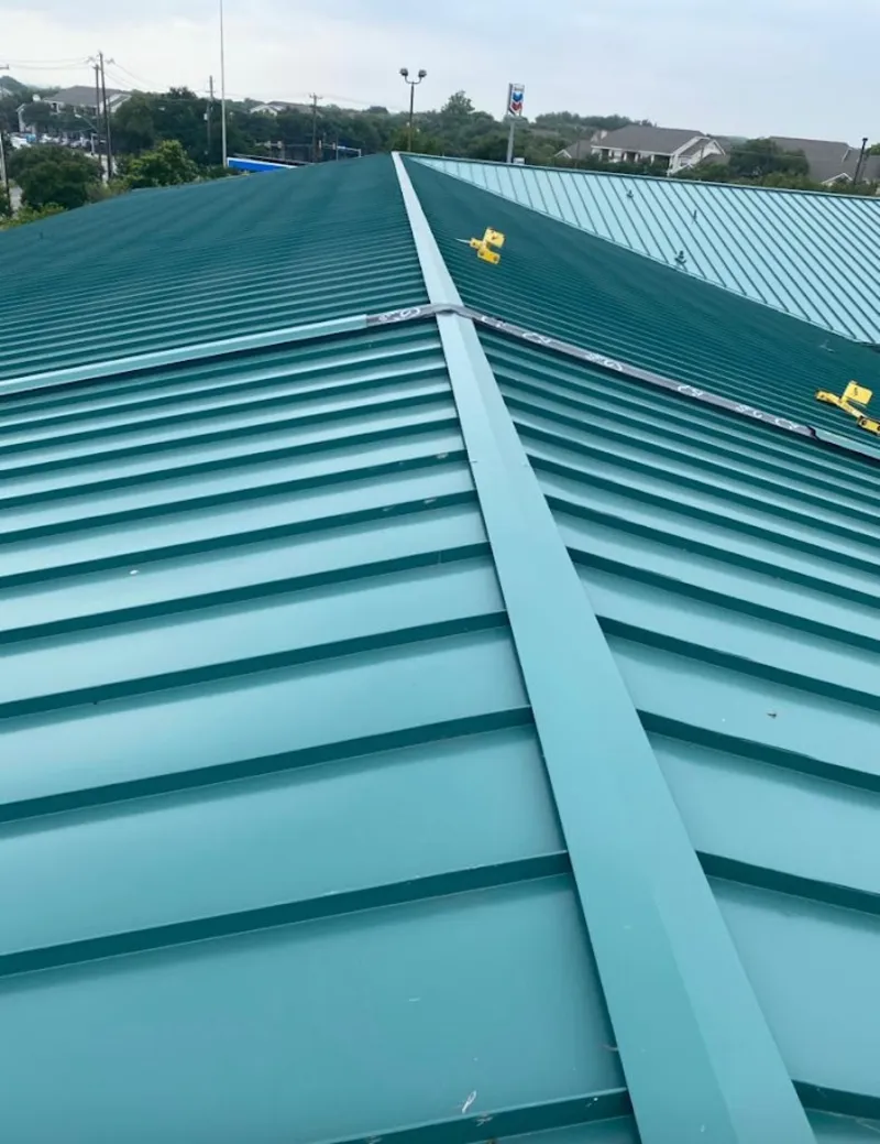 Green commercial metal roof ridge and valley for Metal Roof Repair in Sturtevant